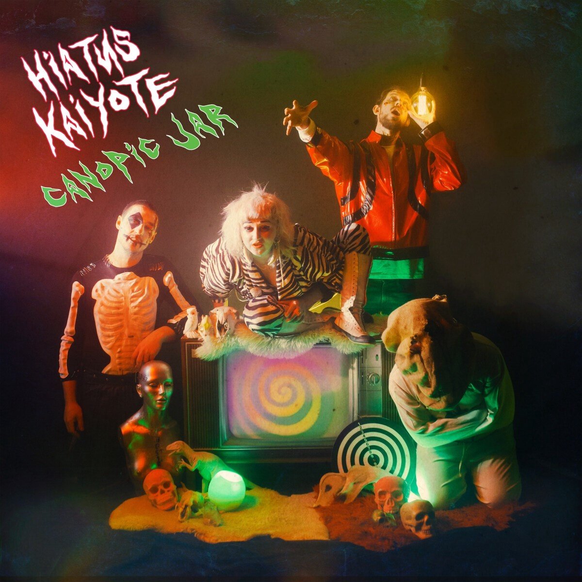 band promo, costumes, skeleton, retro TV, colorful lighting