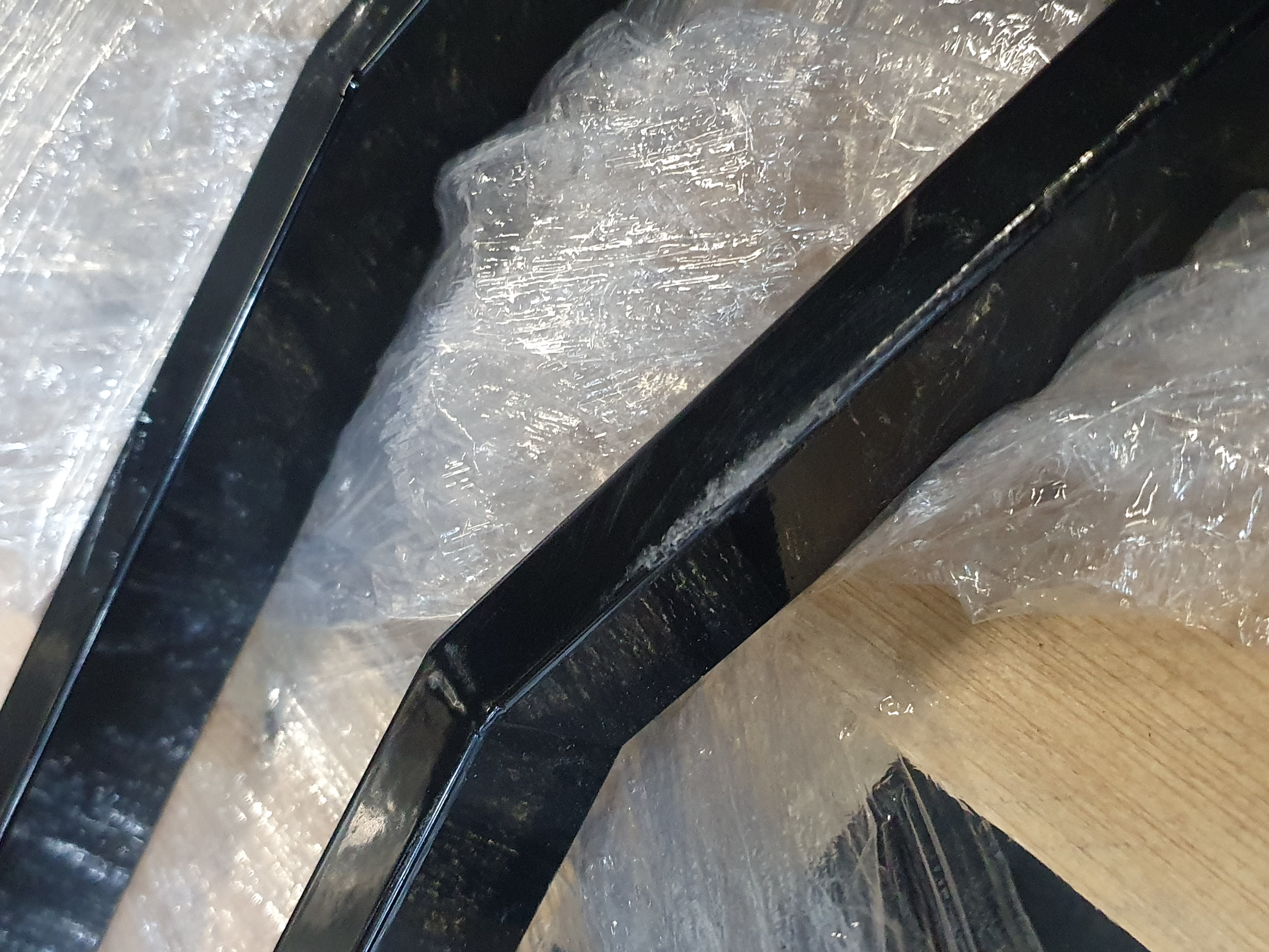 black metal, frame, steel, angular, glass?